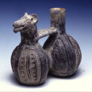 Two-chamber whistling vase decorated with geometric patterns in relief