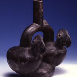 Two-chamber vase with bracket shaped like a parrot