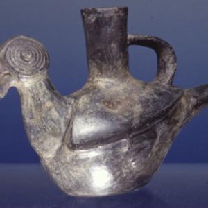 Vase in the shape of a parrot with concentric eyes engraved