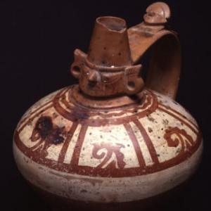 Vaso biconico con collo cefalomorfo  VII – X sec. d.C. (Lambayeque) 