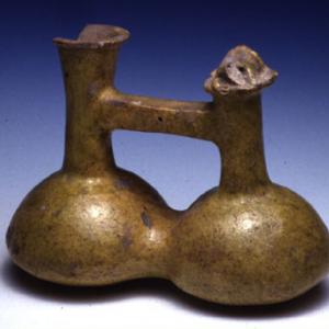 Bicameral whistling vessel with bridge handle